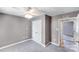 Neutral bedroom features a ceiling fan and a closet, offering a calm and functional space at 150 Windmill Ct, Harmony, NC 28634