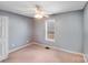 Neutral bedroom features a window and a closet, offering a calm and functional space at 150 Windmill Ct, Harmony, NC 28634