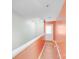 Hallway featuring clean walls, trim, and a door at the end of the hallway at 150 Windmill Ct, Harmony, NC 28634