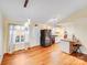 Spacious kitchen with stainless steel appliances, laminate flooring, and a breakfast bar at 150 Windmill Ct, Harmony, NC 28634