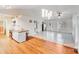 Open-concept living area with modern lighting, connecting to a spacious kitchen with stainless steel appliances at 150 Windmill Ct, Harmony, NC 28634