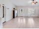 Bright living room featuring tile floors and ample natural light, offering a comfortable and inviting space for relaxation at 150 Windmill Ct, Harmony, NC 28634