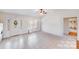 Bright living room featuring tile floors, ceiling fan, and natural light from the window at 150 Windmill Ct, Harmony, NC 28634