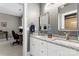 Double vanity bathroom with granite countertop and large mirrors at 18805 Flat Shoals Dr, Cornelius, NC 28031