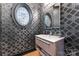 Elegant powder room with patterned wallpaper and modern vanity at 18805 Flat Shoals Dr, Cornelius, NC 28031