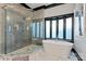 Spa-like bathroom with a large walk-in shower and soaking tub at 18805 Flat Shoals Dr, Cornelius, NC 28031