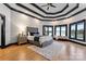 Main bedroom with water views and a cozy sitting area at 18805 Flat Shoals Dr, Cornelius, NC 28031