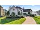 Elegant two-story home with a charming front entrance and landscaping at 18805 Flat Shoals Dr, Cornelius, NC 28031