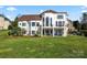 Luxury home with a large backyard, expansive patio, and lake views at 18805 Flat Shoals Dr, Cornelius, NC 28031