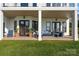 Spacious covered patio with seating area, overlooking the lake at 18805 Flat Shoals Dr, Cornelius, NC 28031