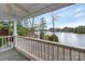 Deck overlooking lake with wooden railing at 192 Diana Dr, Mount Gilead, NC 27306