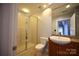 Bathroom with shower, toilet and granite vanity at 505 E 6Th St # 301, Charlotte, NC 28202