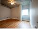 Bedroom with hardwood floors and a large window at 505 E 6Th St # 301, Charlotte, NC 28202
