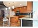 Modern kitchen with granite counters and wood cabinets at 505 E 6Th St # 301, Charlotte, NC 28202