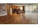 Open concept kitchen with island and hardwood floors at 505 E 6Th St # 301, Charlotte, NC 28202
