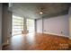 Living room with hardwood floors and large windows at 505 E 6Th St # 301, Charlotte, NC 28202