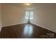 Bright bedroom with wood-look floors and a window letting in natural light at 515 37Th Sw St, Hickory, NC 28602