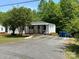 Well-maintained home exterior featuring ample parking and a welcoming covered porch area at 515 37Th Sw St, Hickory, NC 28602