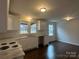 Well-lit kitchen featuring white cabinets, marble countertops, and modern fixtures at 515 37Th Sw St, Hickory, NC 28602