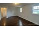 Well-lit living room featuring modern wood flooring and a calming neutral color palette at 515 37Th Sw St, Hickory, NC 28602