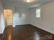 Bright, neutral living area with wood flooring and views to other rooms at 515 37Th Sw St, Hickory, NC 28602