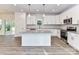 Modern kitchen featuring white cabinetry, stainless steel appliances, a stylish island, and sleek granite countertops at 5613 Morgan Mill Rd, Monroe, NC 28110