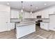 Modern kitchen featuring white cabinets, stainless appliances, a subway tile backsplash, and a granite island with seating at 5613 Morgan Mill Rd, Monroe, NC 28110