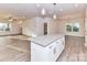Bright kitchen with an island bar flows into the living spaces at 5613 Morgan Mill Rd, Monroe, NC 28110