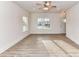 Spacious living room with modern gray flooring, recessed lighting, and large windows at 5613 Morgan Mill Rd, Monroe, NC 28110