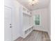 Bright mudroom with custom built-in storage, bench, and cubbies, offering practical organization and style at 5613 Morgan Mill Rd, Monroe, NC 28110
