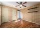 Spacious bedroom with hardwood floors, neutral walls, and ample closet space at 101 Wynnchester Rd, Gastonia, NC 28056