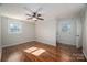 Bedroom with hardwood floors, ceiling fan and built-in shelving at 101 Wynnchester Rd, Gastonia, NC 28056