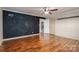 Bedroom with hardwood floors, ceiling fan and chalkboard accent wall at 101 Wynnchester Rd, Gastonia, NC 28056