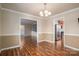 Bright dining room with hardwood floors and access to kitchen at 101 Wynnchester Rd, Gastonia, NC 28056