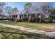 Brick ranch house with mature trees and lawn at 101 Wynnchester Rd, Gastonia, NC 28056