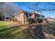 Side view of brick ranch house, neat landscaping at 101 Wynnchester Rd, Gastonia, NC 28056