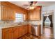 Kitchen with wood cabinets, granite counters, and stainless steel appliances at 101 Wynnchester Rd, Gastonia, NC 28056