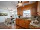 Bright kitchen featuring wood cabinets and a charming dining area at 101 Wynnchester Rd, Gastonia, NC 28056