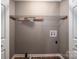 Laundry room with wire shelving and hookups for washer and dryer at 101 Wynnchester Rd, Gastonia, NC 28056