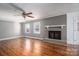 Living room with hardwood floors, fireplace and ceiling fan at 101 Wynnchester Rd, Gastonia, NC 28056