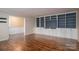 Bright living room with built-in shelving and hardwood floors at 101 Wynnchester Rd, Gastonia, NC 28056