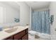 Clean bathroom with shower/tub combo and updated vanity at 117 Fairfield Dr, Troutman, NC 28166