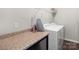 Laundry room with washer, dryer, and folding counter space at 117 Fairfield Dr, Troutman, NC 28166