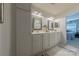 Double vanity bathroom with a large mirror and stylish fixtures at 12117 Frogs Leap Ct, Charlotte, NC 28277