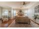 Spacious bedroom with a large bed, neutral color scheme, and hardwood floors at 12117 Frogs Leap Ct, Charlotte, NC 28277