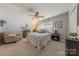 Charming bedroom with a ceiling fan and ensuite bath at 12117 Frogs Leap Ct, Charlotte, NC 28277