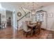 Bright dining room features a wooden table, neutral decor, and hardwood floors at 12117 Frogs Leap Ct, Charlotte, NC 28277