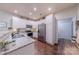 Modern kitchen with white cabinets and granite countertops at 12117 Frogs Leap Ct, Charlotte, NC 28277