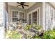 Relaxing patio with seating, potted plants, and French doors at 12117 Frogs Leap Ct, Charlotte, NC 28277