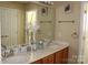 Double vanity bathroom with large mirror at 12205 Westbury Glen Ct # 17, Charlotte, NC 28262